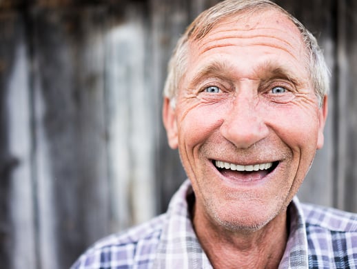 Older man with a big, bright, joyful smile